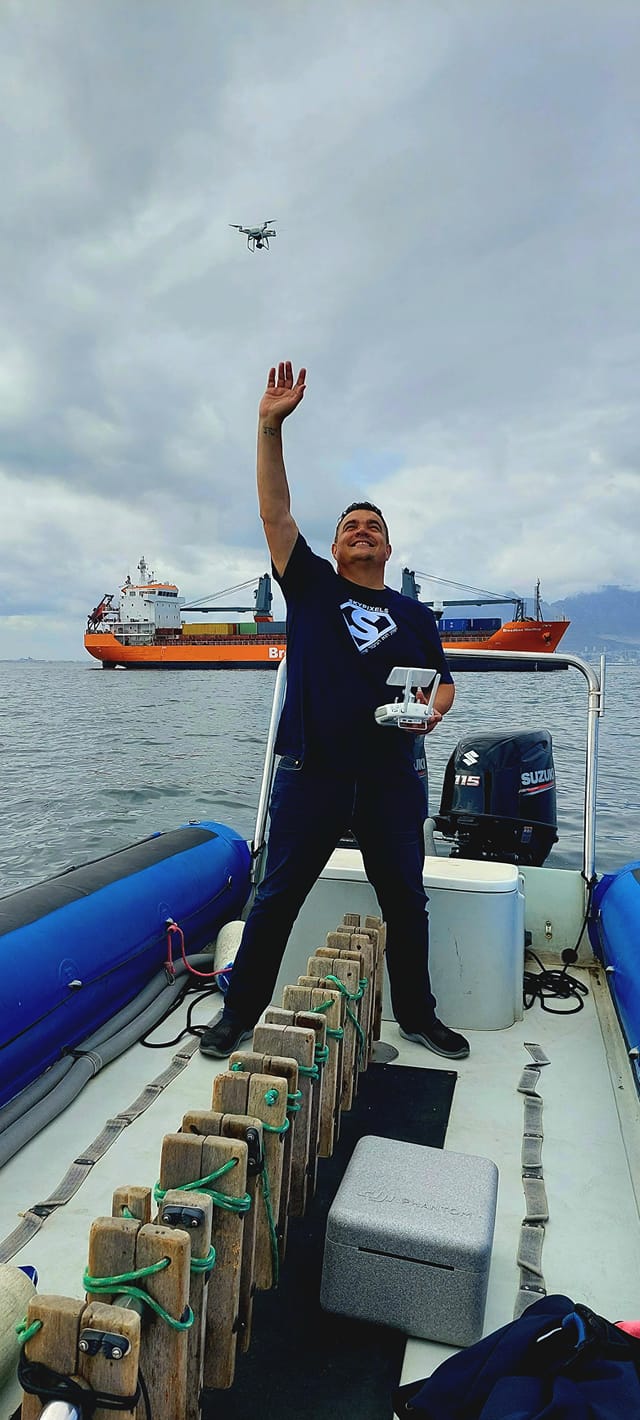 Professional drone ship photography team capturing vessel imagery at Cape Town port